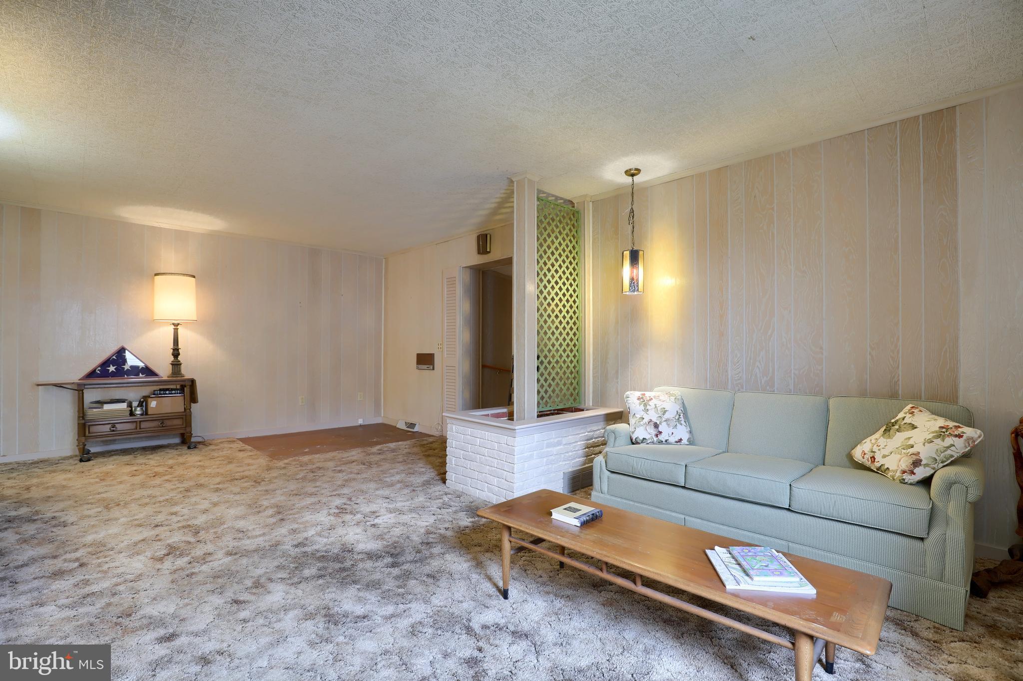 620 South Spruce Street Lititz, PA 17543 - Photo 34 of 57 a living room with furniture and a chandelier