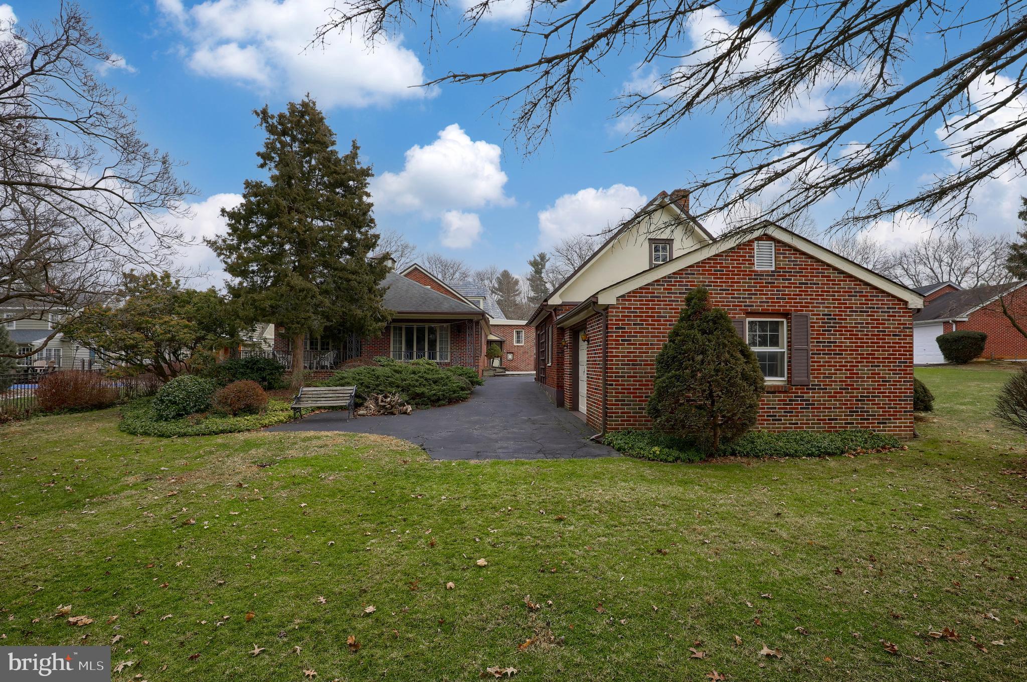620 South Spruce Street Lititz, PA 17543 - Photo 53 of 57 a view of a yard in front of a house with plants and large tree