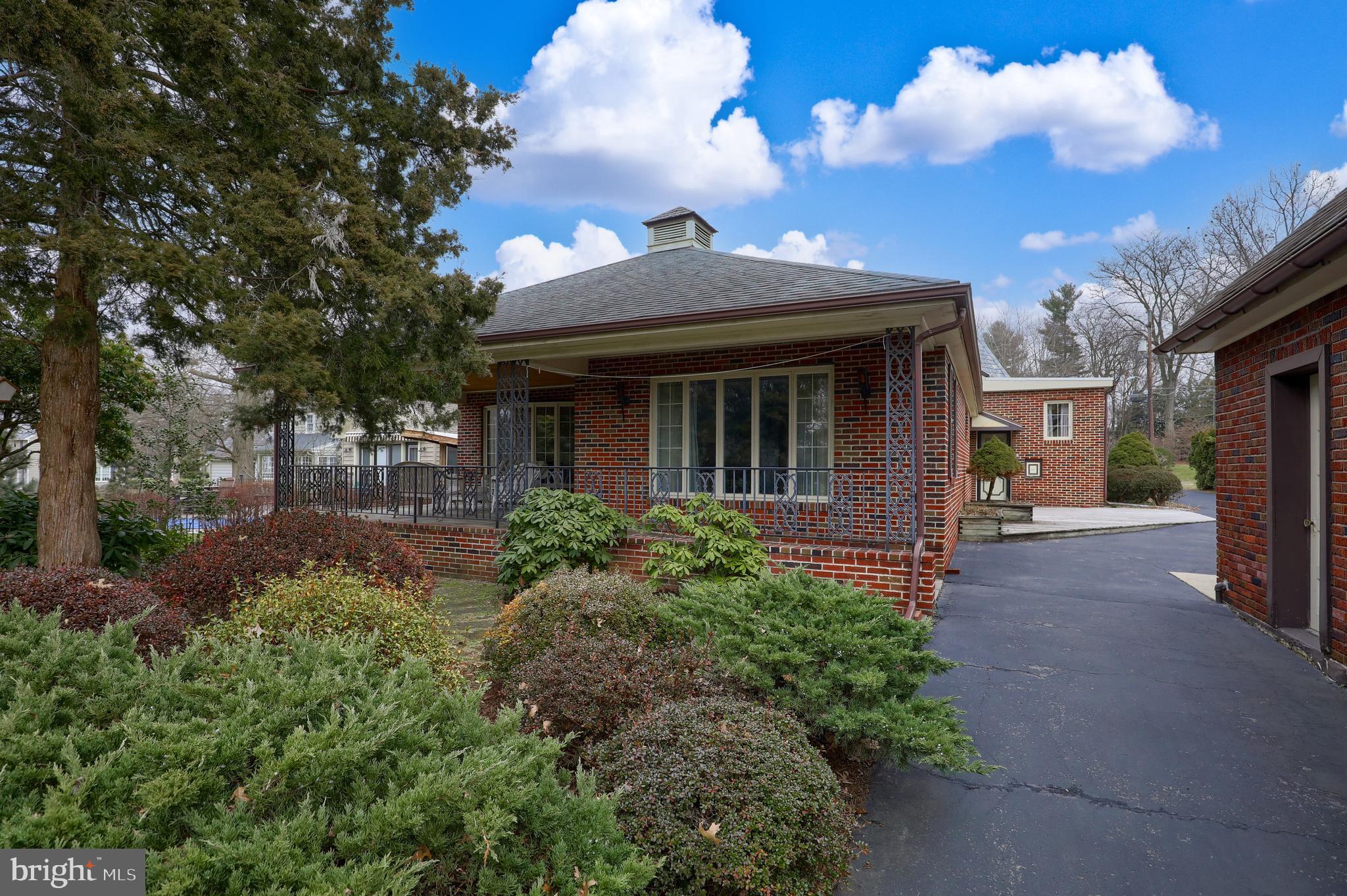 620 South Spruce Street Lititz, PA 17543 - Photo 8 of 57 a view of a brick house with a large trees and plants