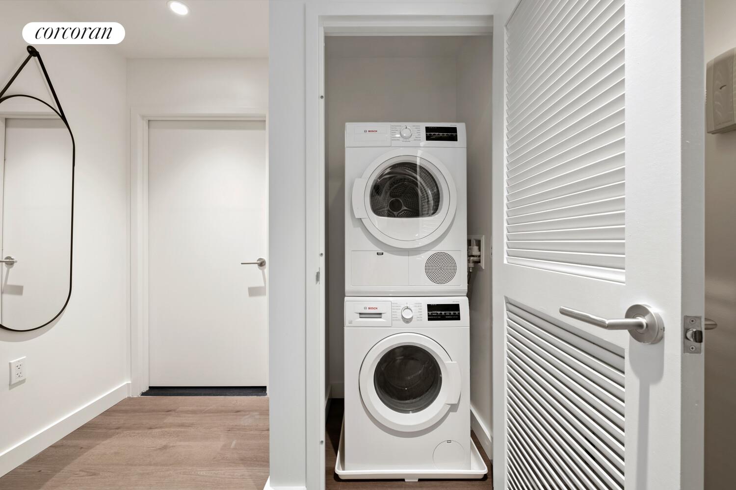 166-20 90th Avenue, Unit 357 Queens, NY 11432 - Photo 8 of 15 a utility room with dryer and washer
