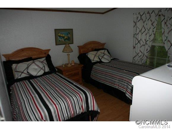 1298 Grassy Knob Road Rutherfordton, NC 28139 - Photo 14 of 18 a bedroom with two beds and a painting on the wall