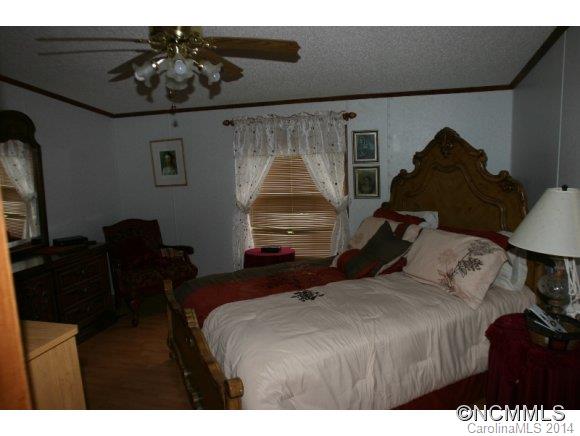 1298 Grassy Knob Road Rutherfordton, NC 28139 - Photo 16 of 18 a bedroom with a bed and window