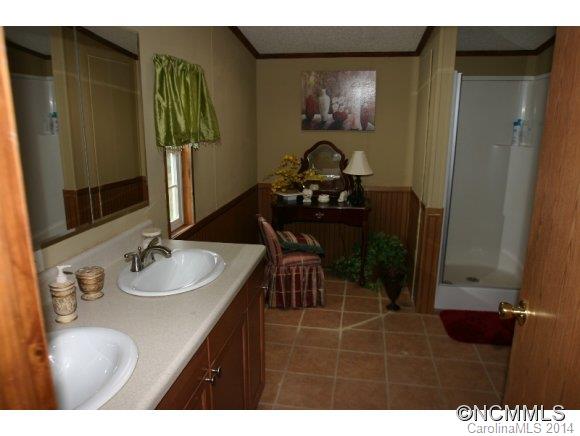 1298 Grassy Knob Road Rutherfordton, NC 28139 - Photo 17 of 18 a bathroom with a sink and a mirror