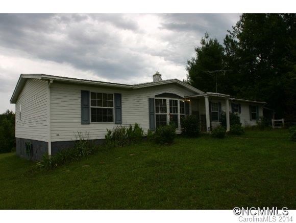 1298 Grassy Knob Road Rutherfordton, NC 28139 - Photo 3 of 18 a front view of a house with a garden