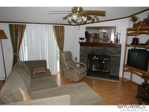 1298 Grassy Knob Road Rutherfordton, NC 28139 - Photo 8 of 18 a living room with furniture and a fireplace