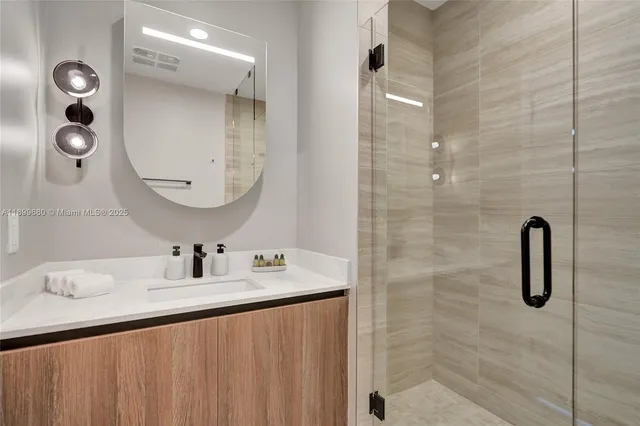 a bathroom with a sink and a mirror