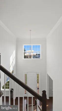 a view of a a dining room with furniture window and wooden floor