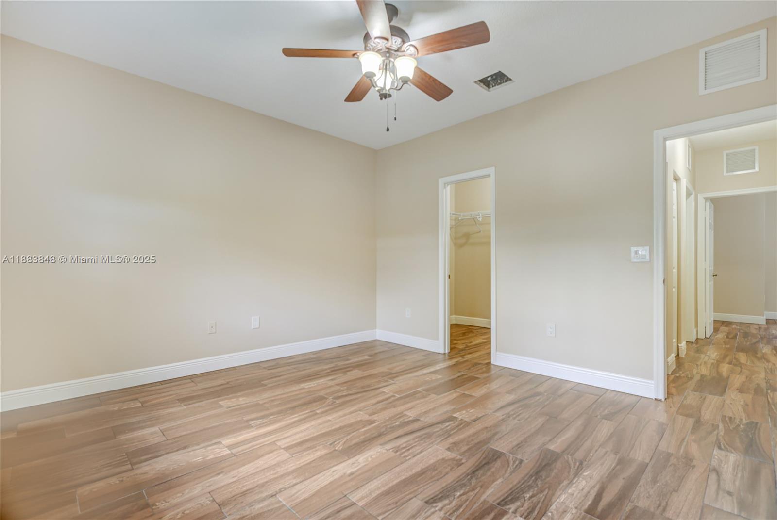 7627 East Stonecreek Circle Davie, FL 33024 - Photo 14 of 29 wooden floor in an empty room
