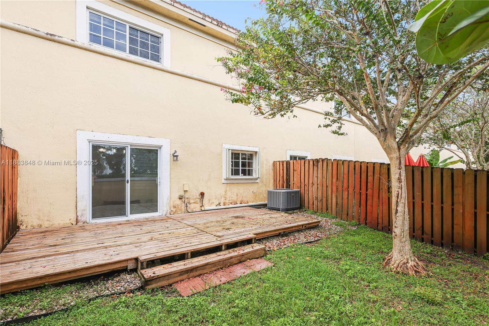 7627 East Stonecreek Circle Davie, FL 33024 - Photo 27 of 29 a house with trees in front of it