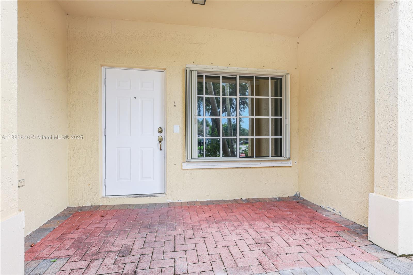 7627 East Stonecreek Circle Davie, FL 33024 - Photo 28 of 29 a view of an empty room with wooden floor and a window
