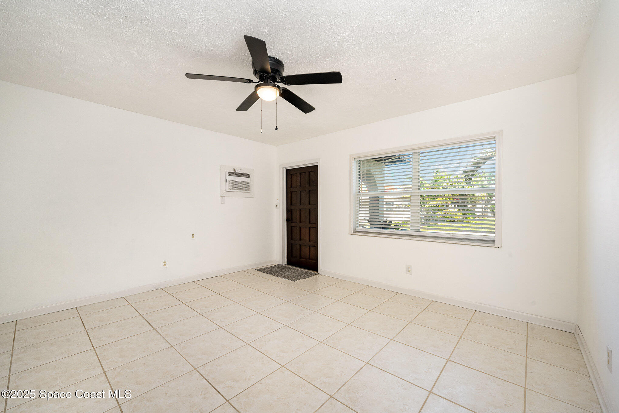121 Del Flora Indialantic, FL 32903 - Photo 3 of 15 a view of an empty room with a window