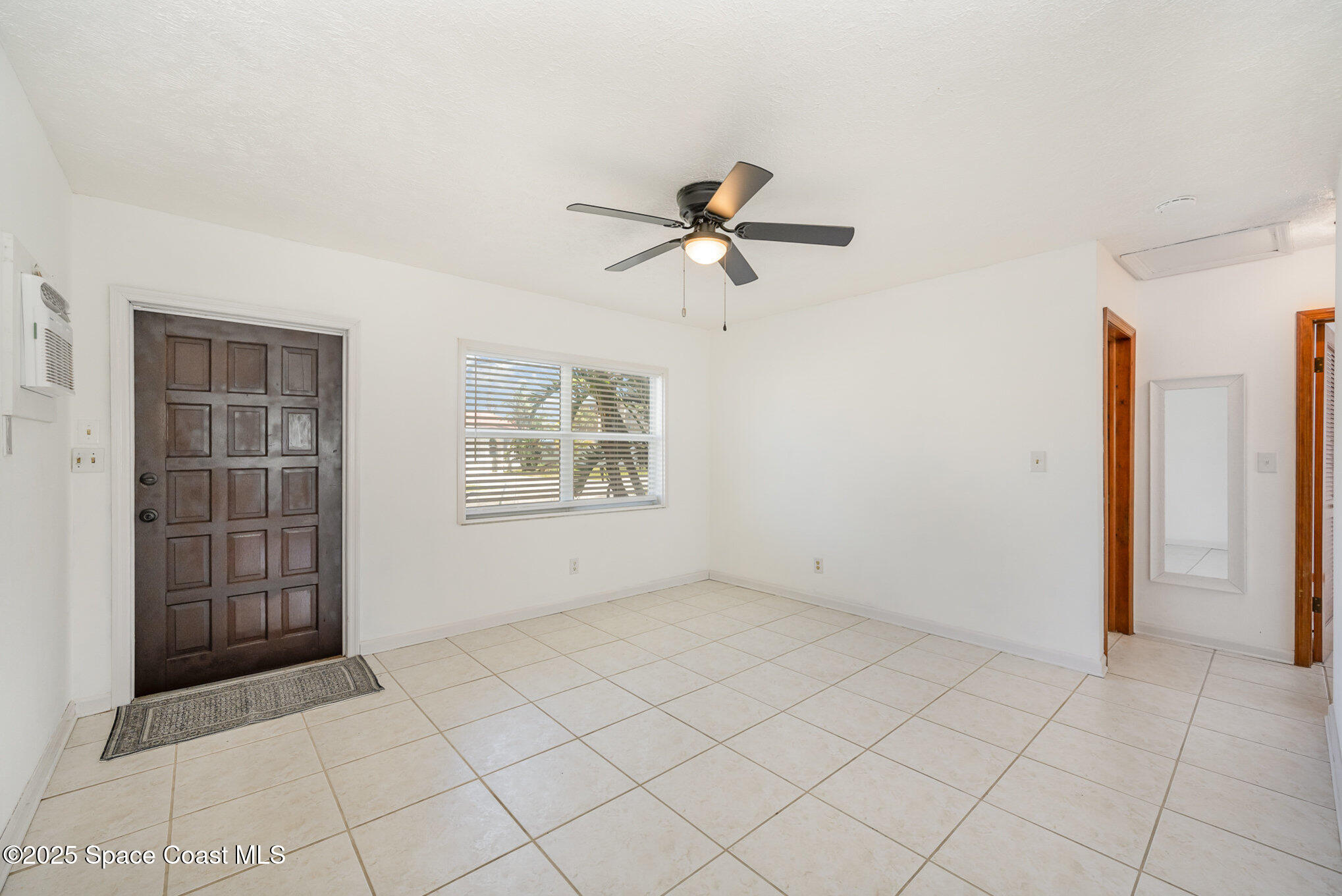 121 Del Flora Indialantic, FL 32903 - Photo 4 of 15 a view of an empty room with a window