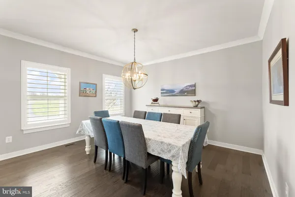a bedroom with a bed next to a large window with the outer view