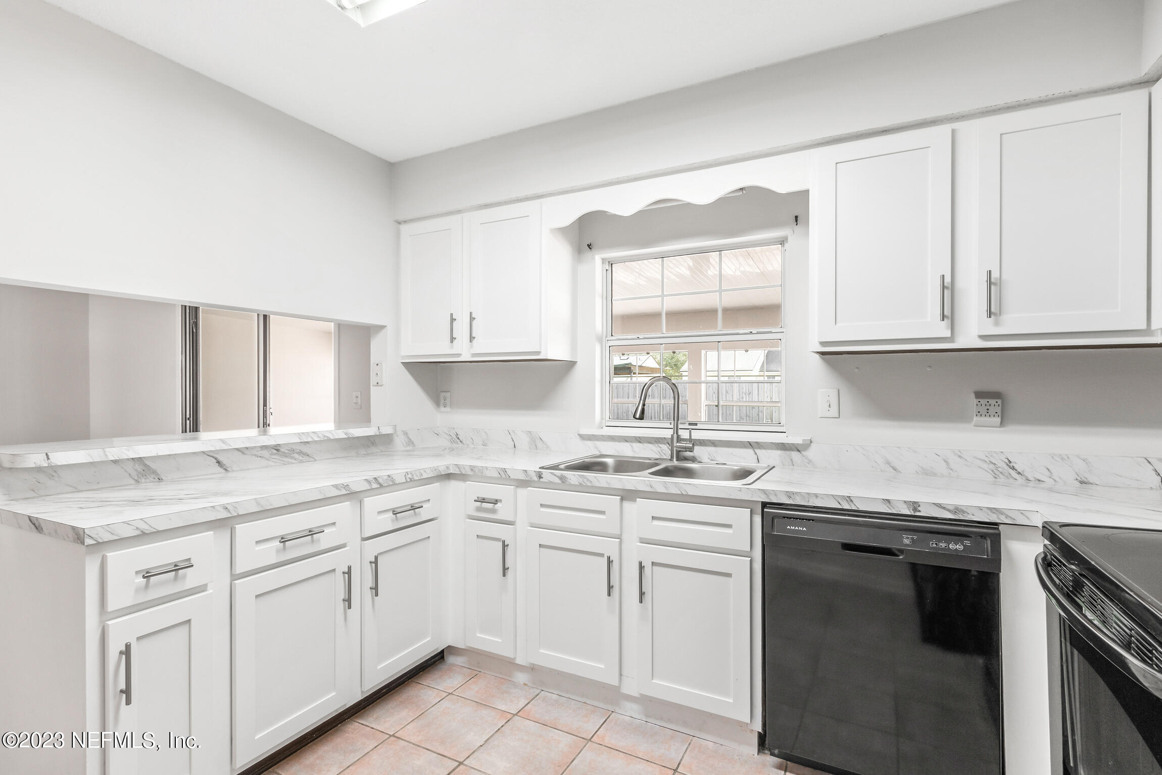 12770 Attrill Road Jacksonville, FL 32258 - Photo 24 of 38 a kitchen with stainless steel appliances granite countertop a sink stove and cabinets