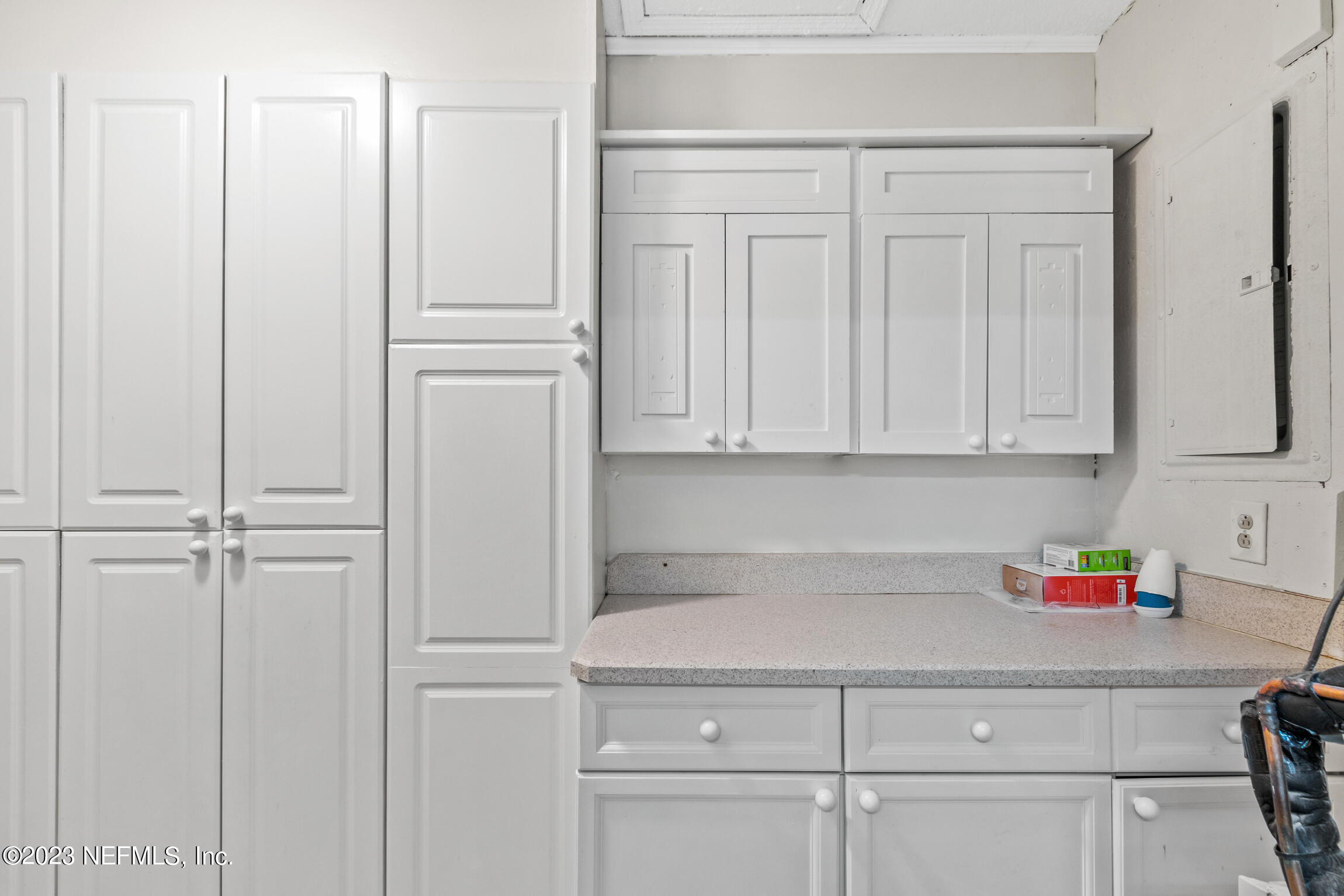 12770 Attrill Road Jacksonville, FL 32258 - Photo 27 of 38 a kitchen with white cabinets and white appliances