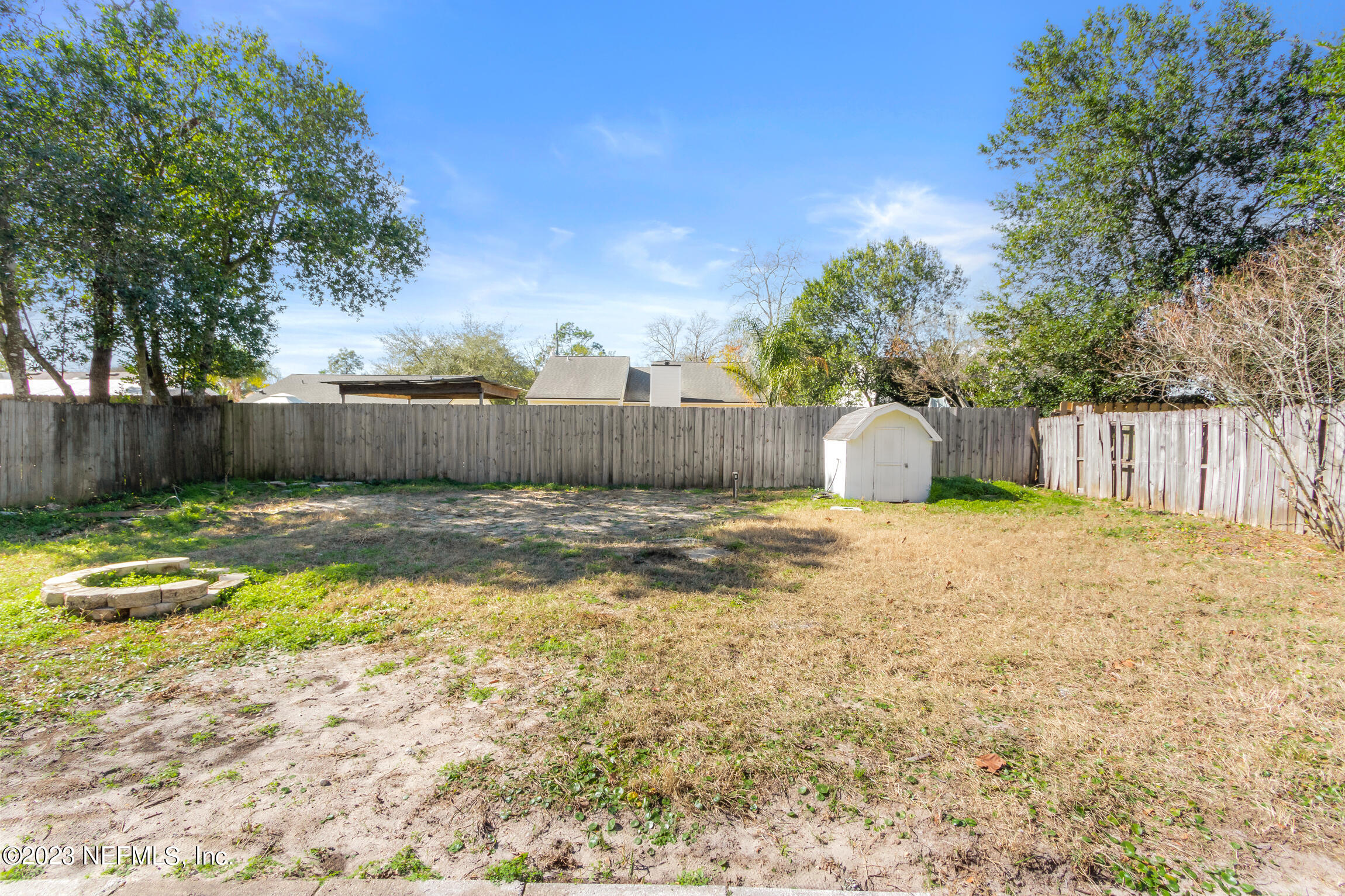 12770 Attrill Road Jacksonville, FL 32258 - Photo 33 of 38 a swimming pool with outdoor seating and yard