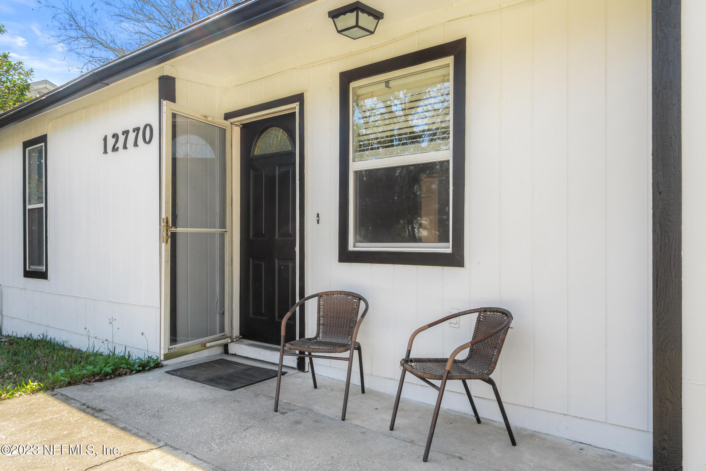 12770 Attrill Road Jacksonville, FL 32258 - Photo 4 of 38 a couple of chairs in front of door