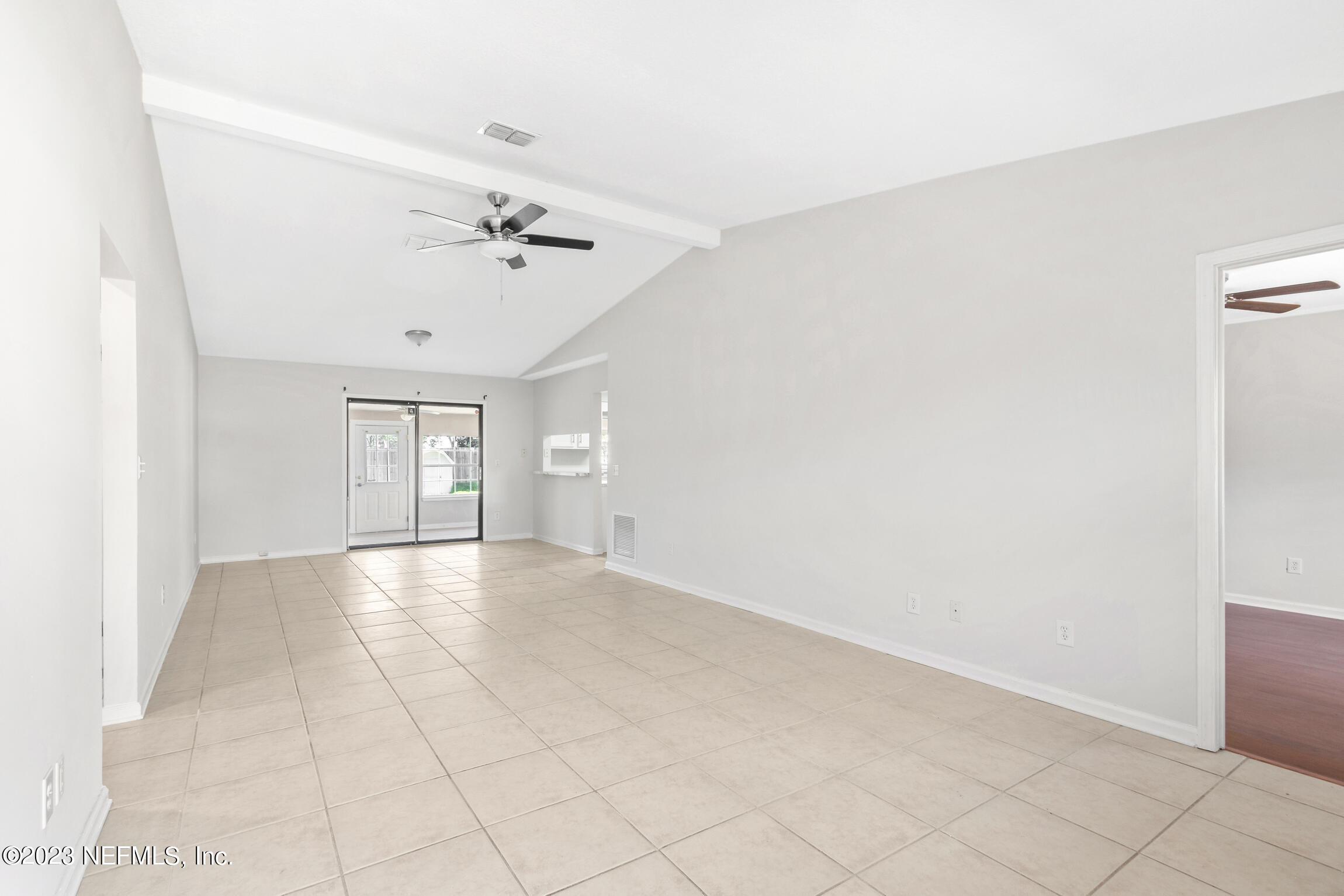 12770 Attrill Road Jacksonville, FL 32258 - Photo 8 of 38 an empty room with windows and fan