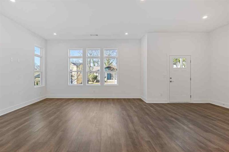 489 Hammons Way Southeast Atlanta, GA 30315 - Photo 4 of 47 an empty room with wooden floor and windows