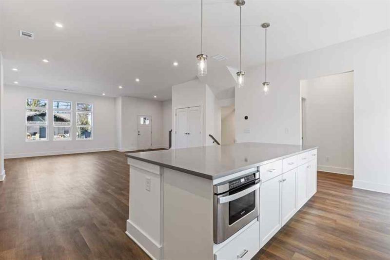 489 Hammons Way Southeast Atlanta, GA 30315 - Photo 10 of 47 a kitchen with a stove and a wooden floor