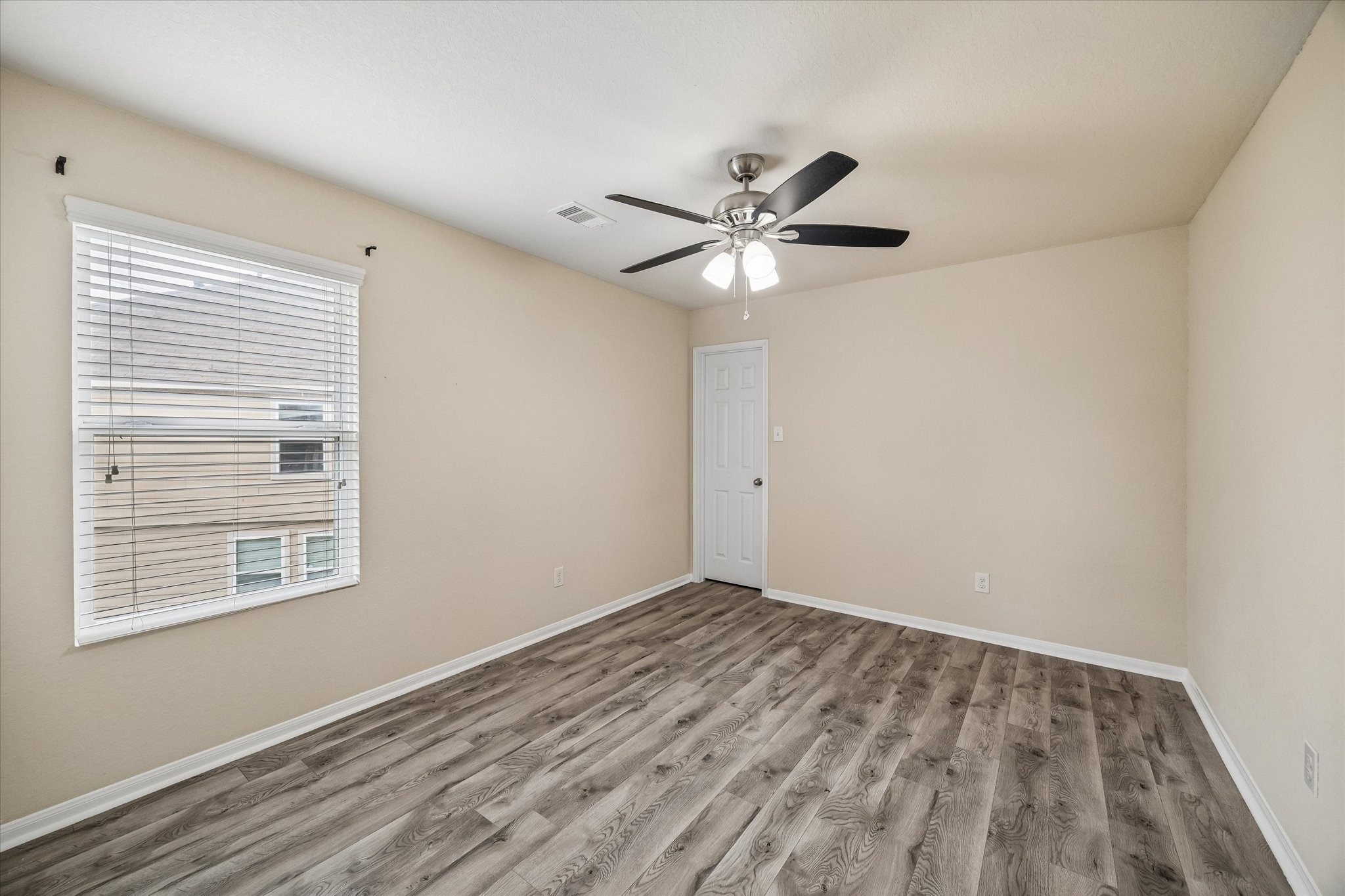 15642 South Fall Fern Circle Houston, TX 77044 - Photo 25 of 32 a view of an empty room with a window