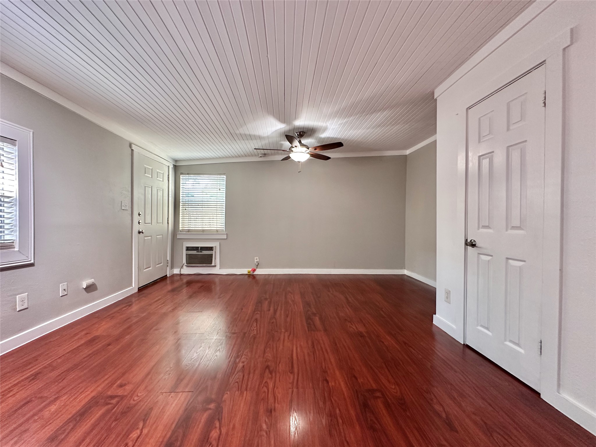 2103 East 16th Street, Unit ANNEX Austin, TX 78702 - Photo 14 of 23 a view of an empty room with wooden floor and a window