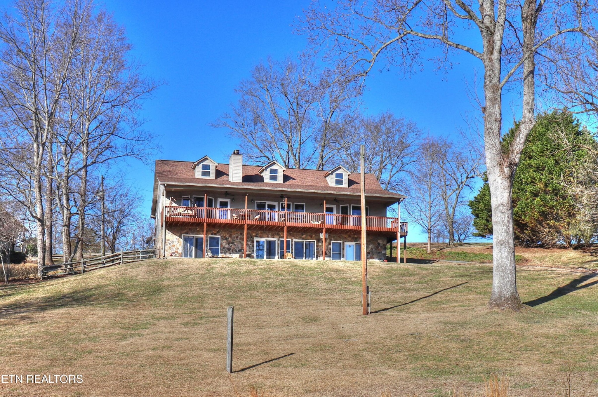 1012 Ewing Road Spring City, TN 37381 - Photo 1 of 1 a view of a large house with a large trees