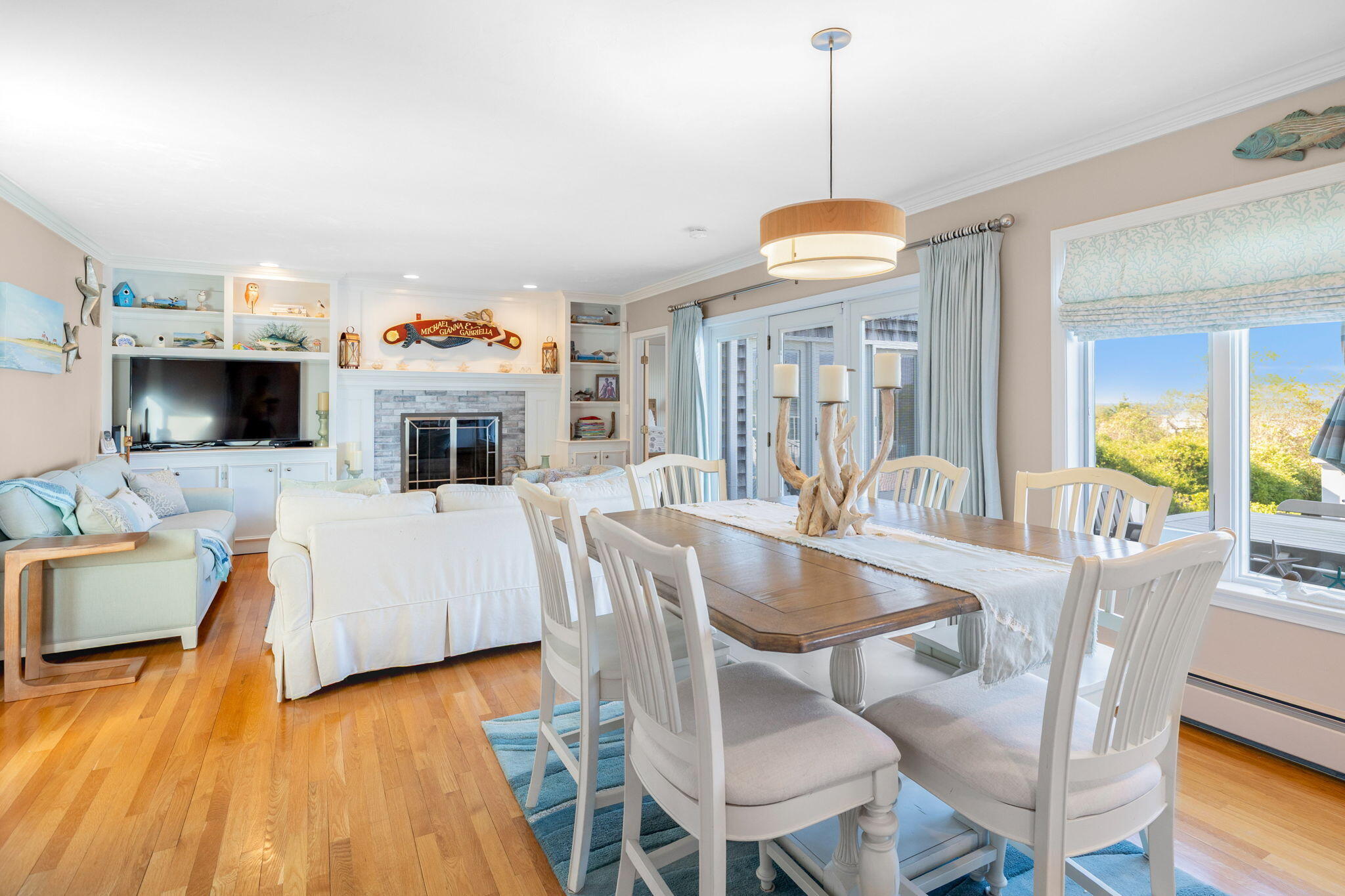 33 Torrey Road East Sandwich, MA 02537 - Photo 11 of 39 a dining room with furniture window wooden floor and chandelier
