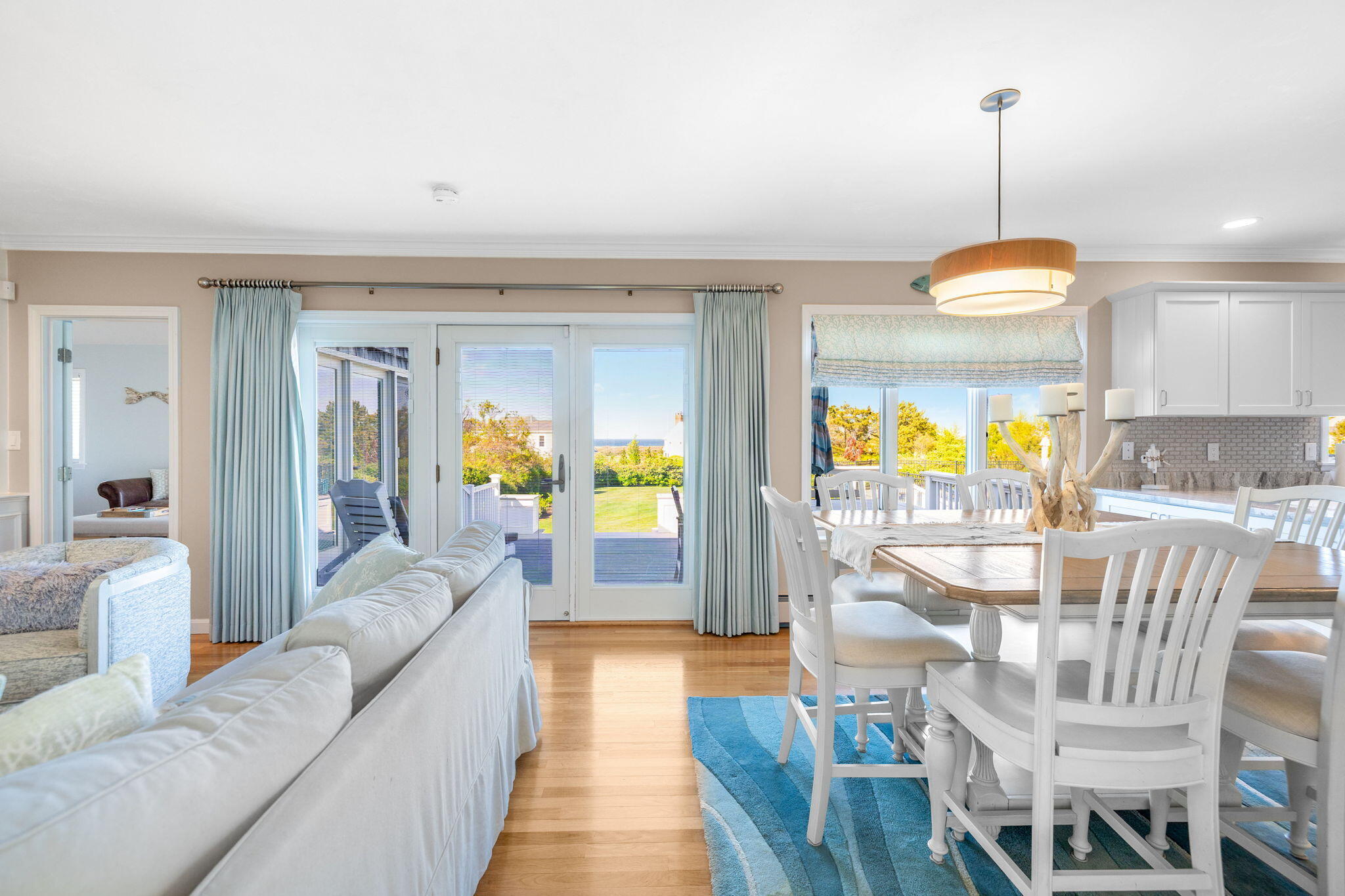 33 Torrey Road East Sandwich, MA 02537 - Photo 12 of 39 a living room with furniture a dining table and a flat screen tv