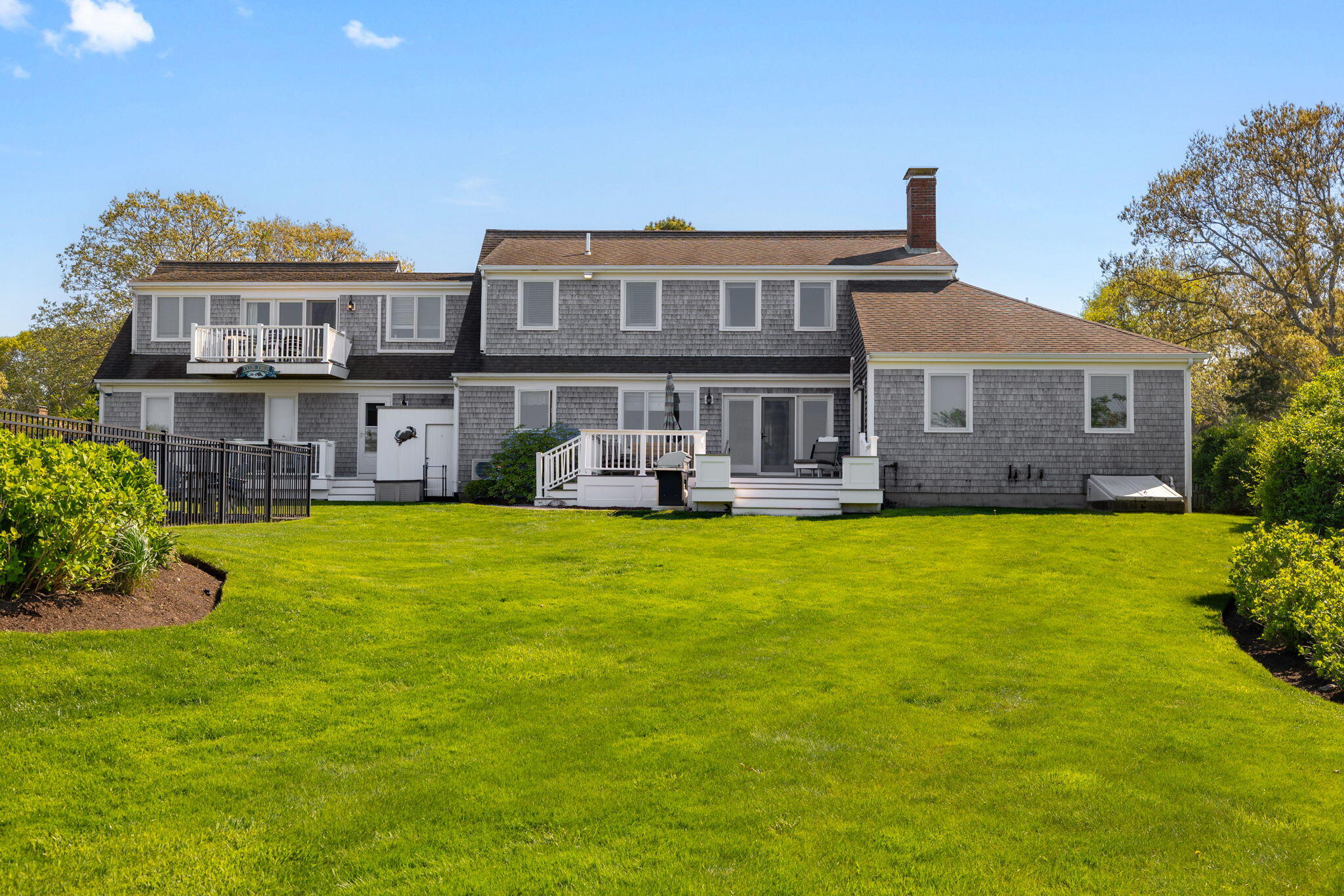 33 Torrey Road East Sandwich, MA 02537 - Photo 28 of 39 a front view of a house with swimming pool having outdoor seating