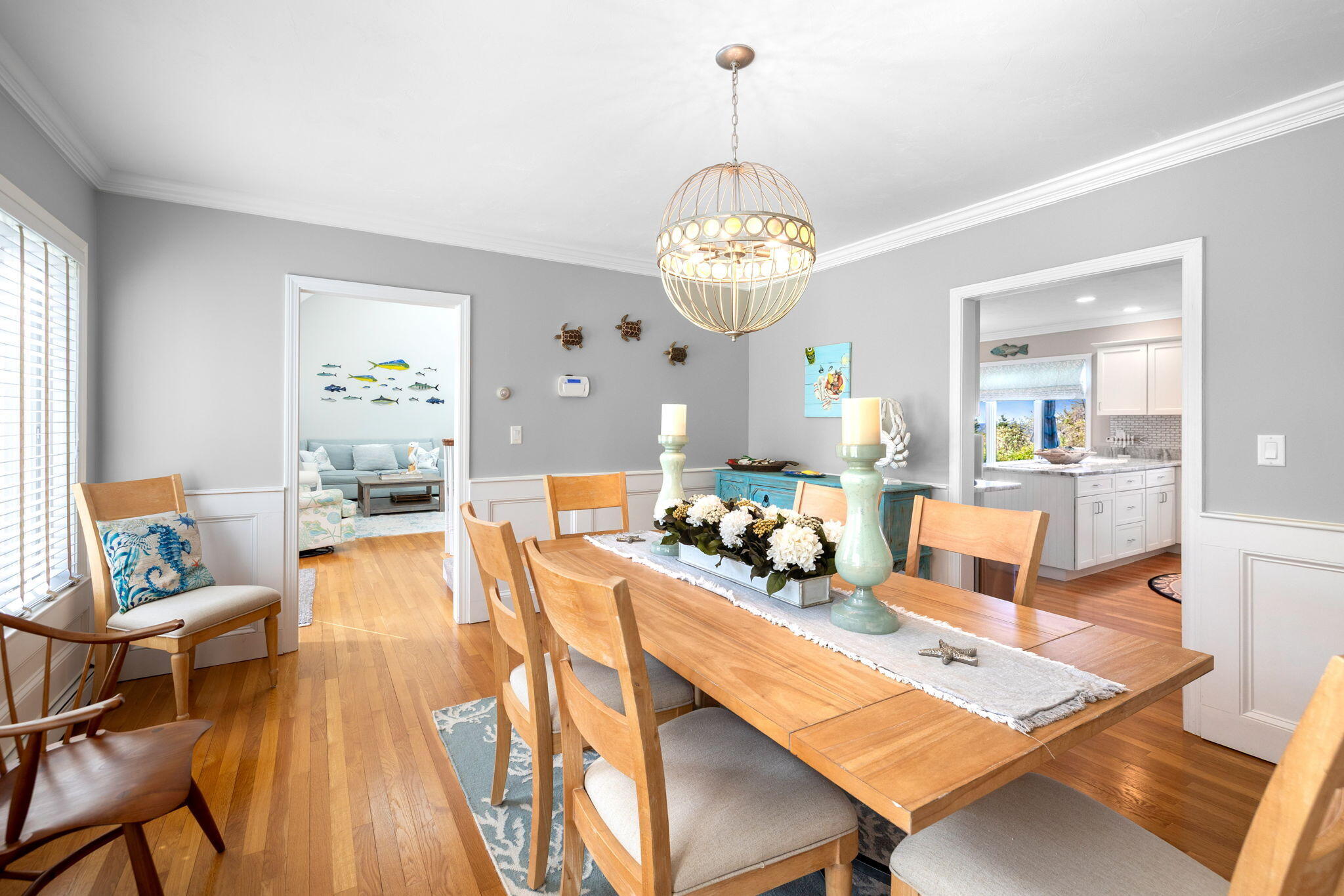 33 Torrey Road East Sandwich, MA 02537 - Photo 7 of 39 a view of a dining room and livingroom with furniture wooden floor a chandelier