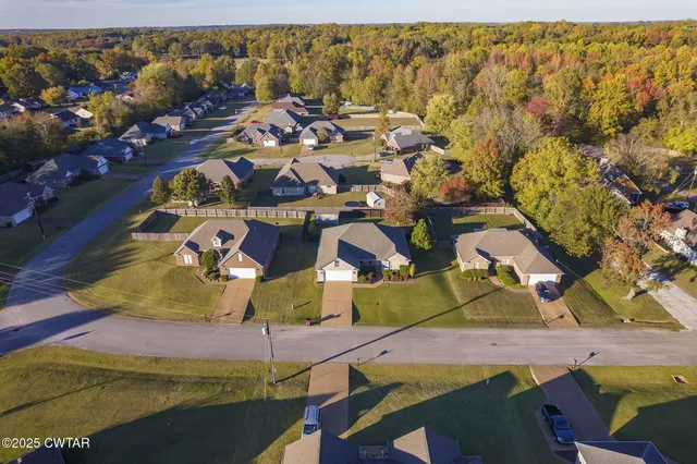 an aerial view of a house with a ocean view
