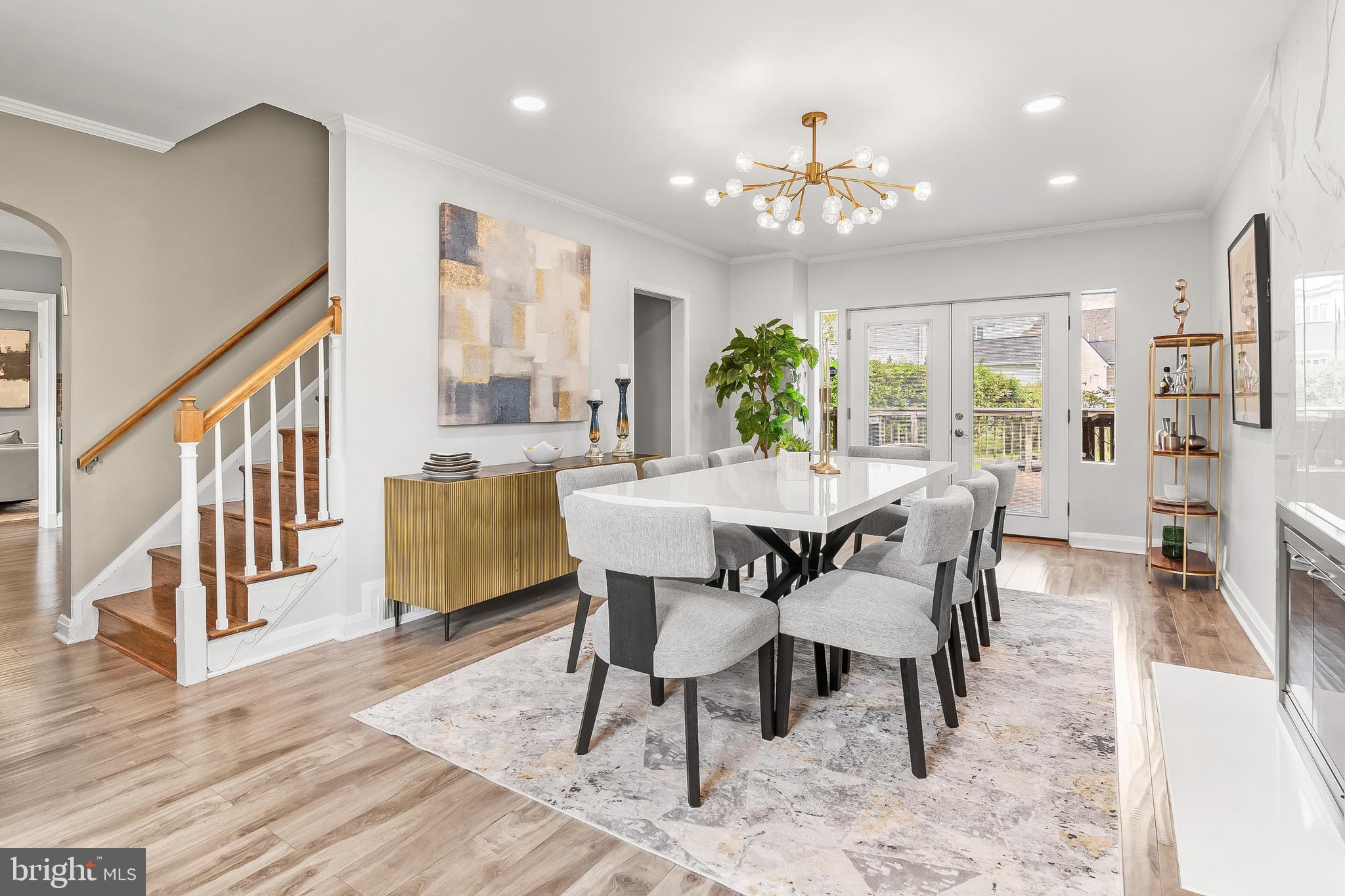 3302 Northbrook Road Pikesville, MD 21208 - Photo 12 of 45 a view of a dining room with furniture a chandelier and wooden floor