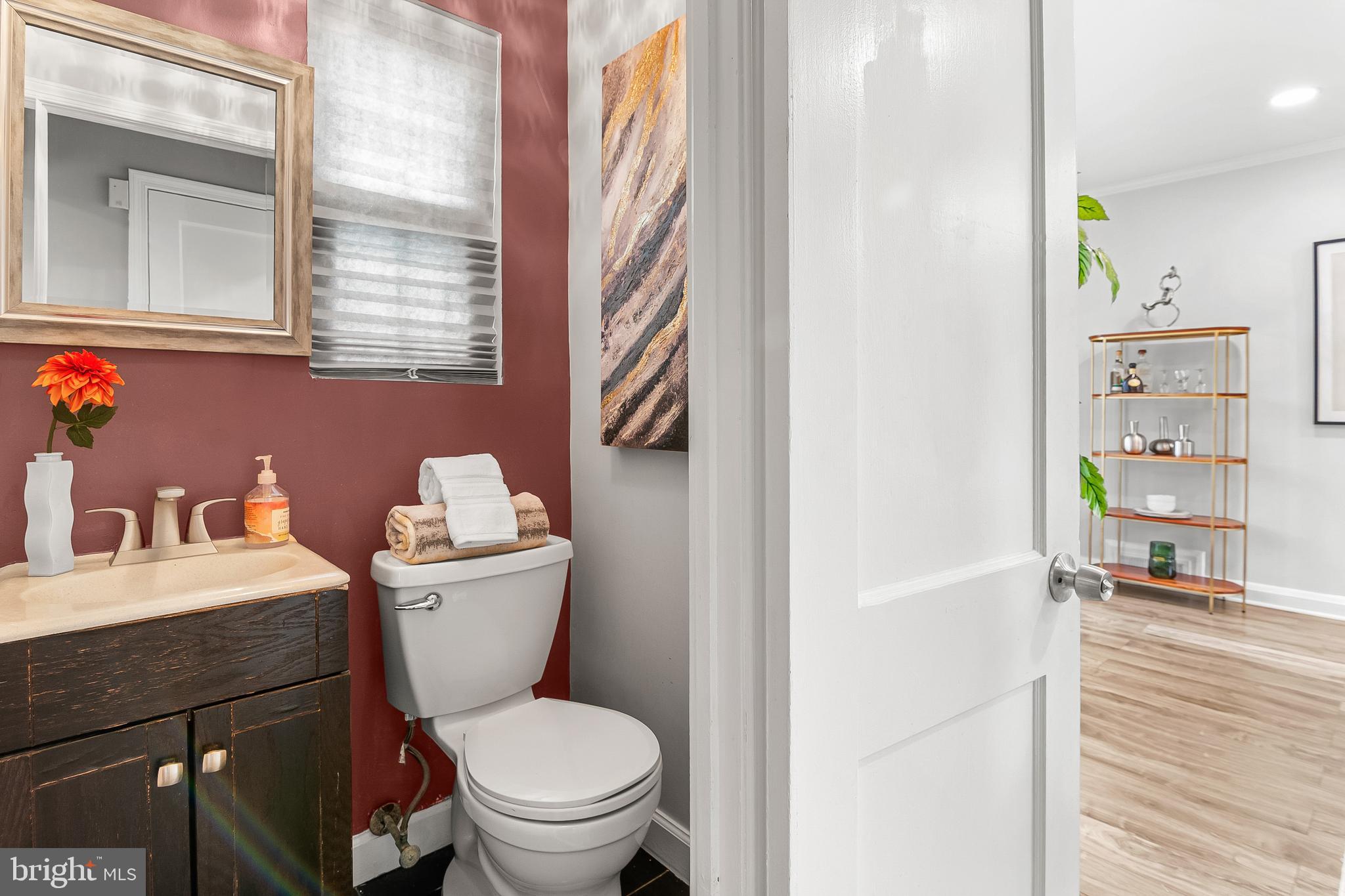 3302 Northbrook Road Pikesville, MD 21208 - Photo 20 of 45 a bathroom with a sink a toilet and a mirror