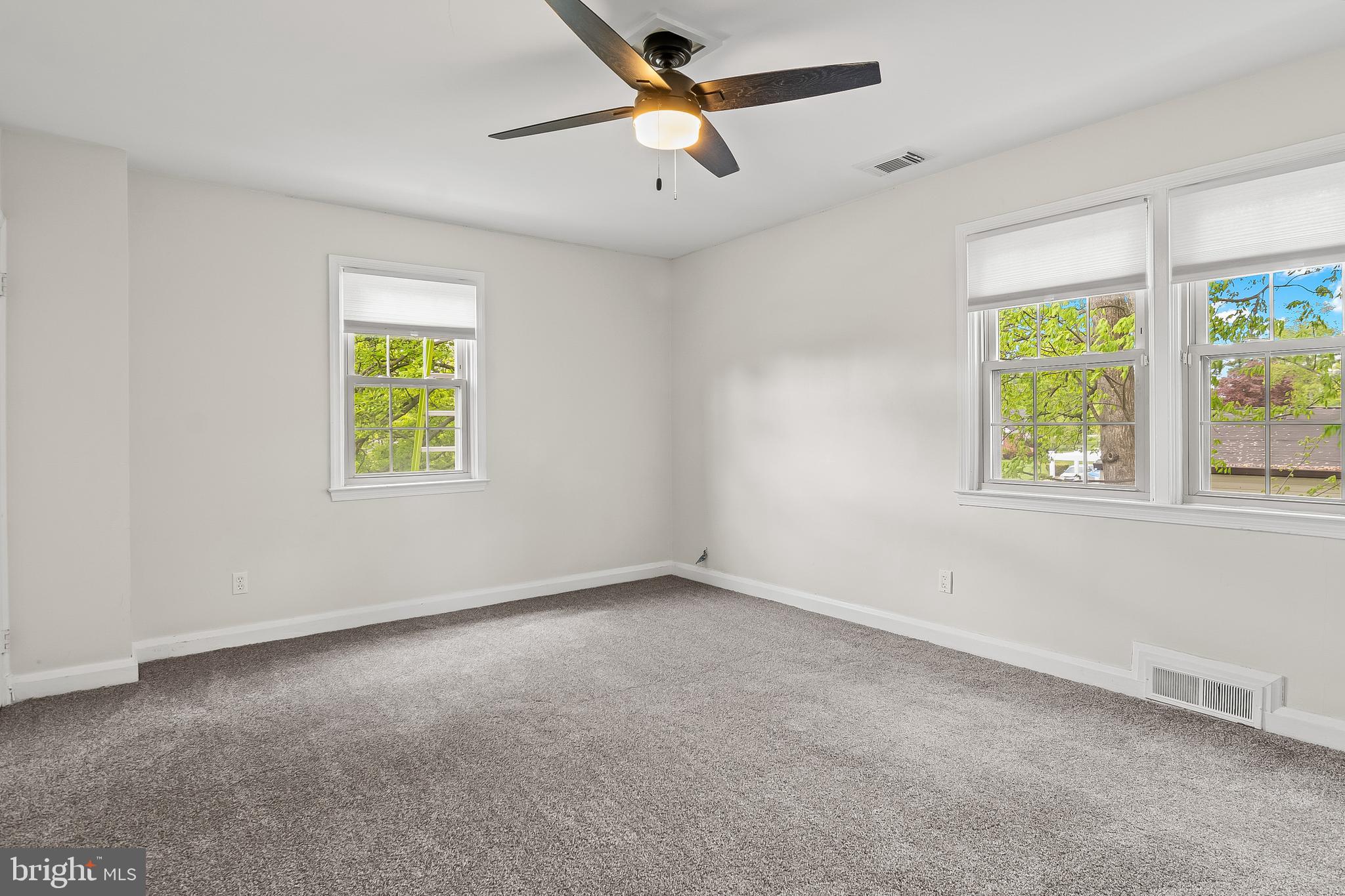 3302 Northbrook Road Pikesville, MD 21208 - Photo 28 of 45 an empty room with a window and a ceiling fan