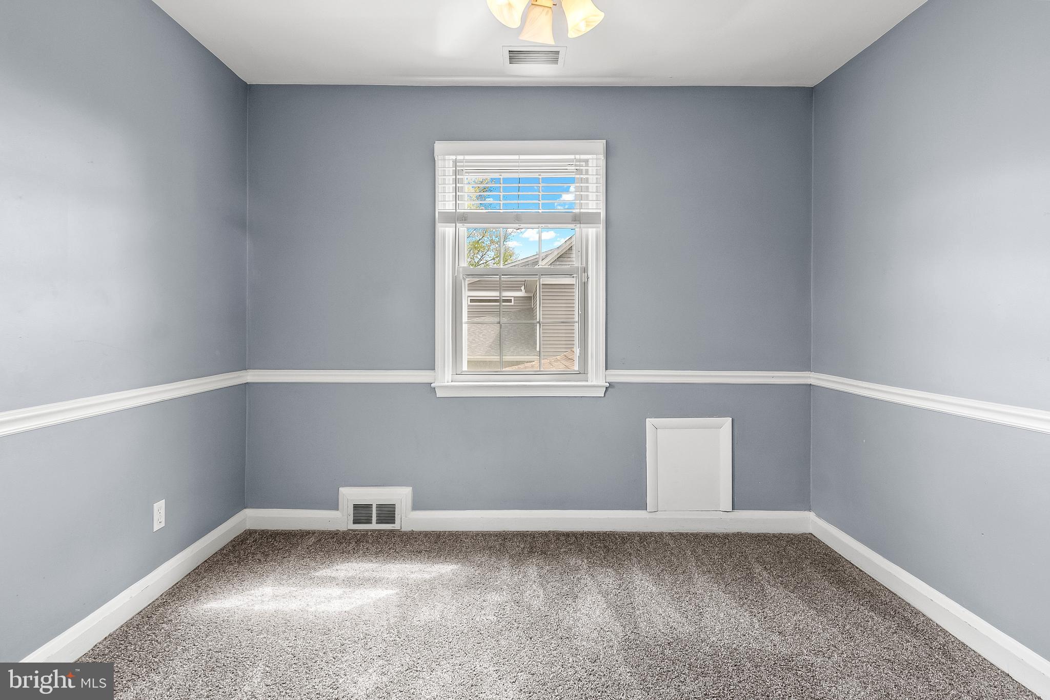 3302 Northbrook Road Pikesville, MD 21208 - Photo 30 of 45 a view of an empty room with a window