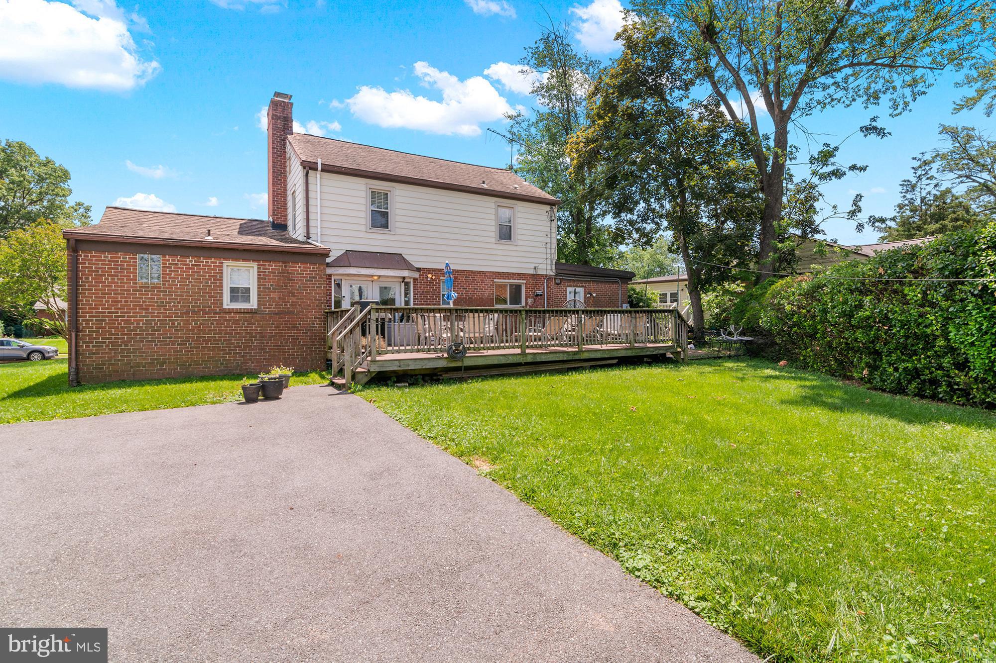 3302 Northbrook Road Pikesville, MD 21208 - Photo 39 of 45 a view of a house with a yard and a patio