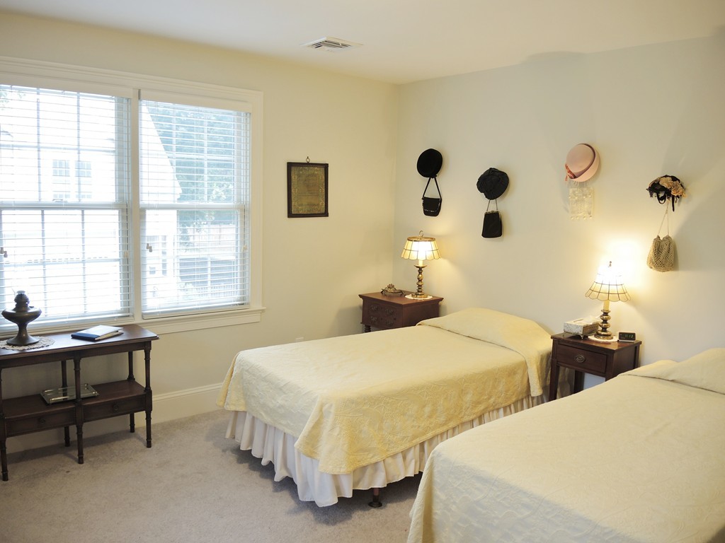 38 Maple Street, Unit 2 Needham, MA 02492 - Photo 15 of 26 a bedroom with two beds and a table