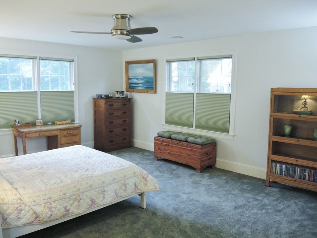 38 Maple Street, Unit 2 Needham, MA 02492 - Photo 18 of 26 a bedroom with a bed and a cabinets