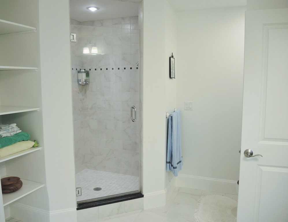 38 Maple Street, Unit 2 Needham, MA 02492 - Photo 20 of 26 a bathroom with a shower