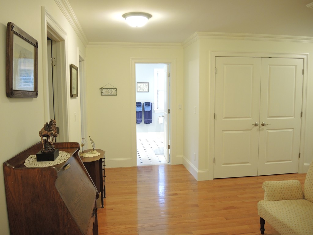 38 Maple Street, Unit 2 Needham, MA 02492 - Photo 24 of 26 a view of a hallway with workspace