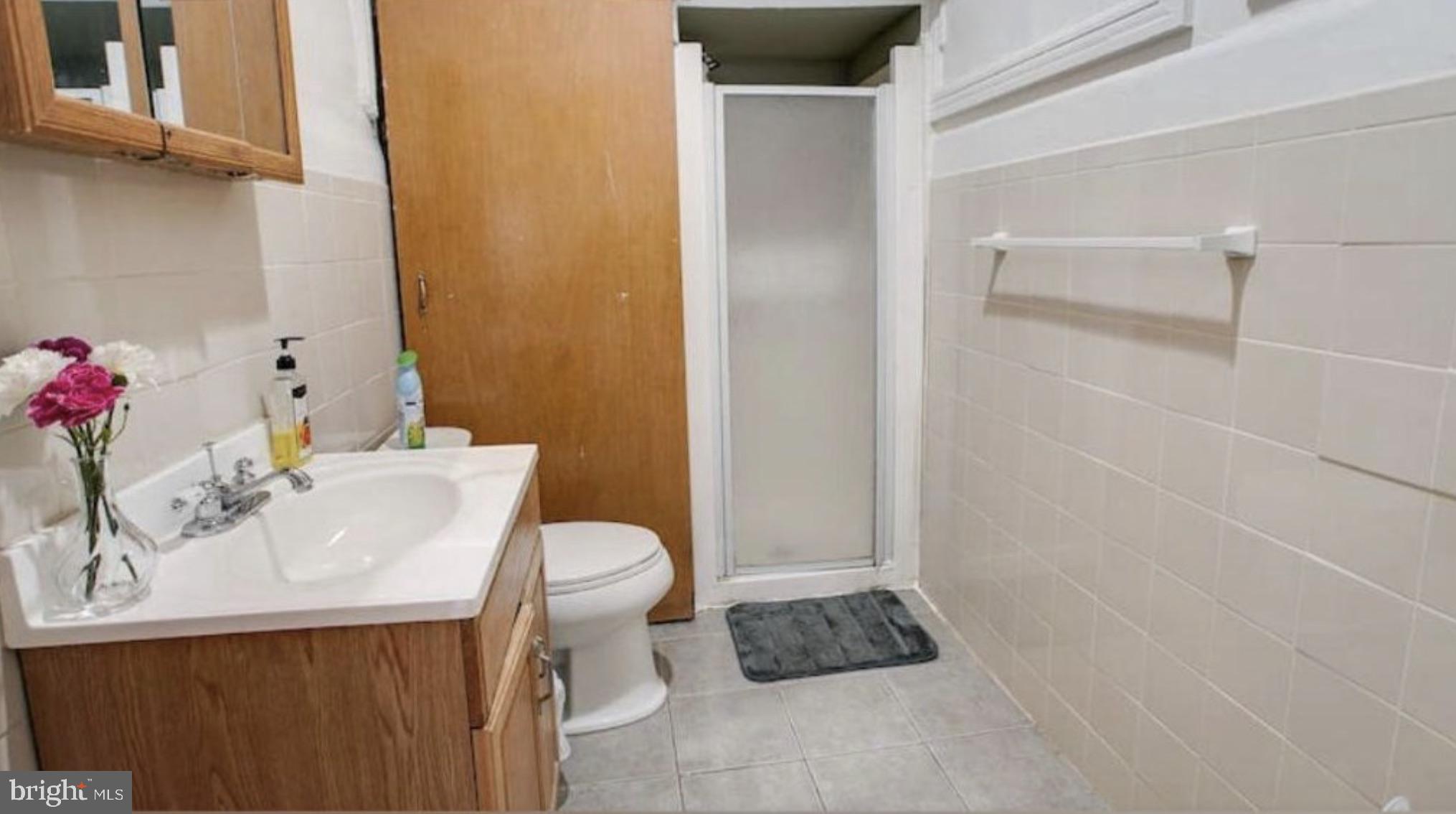 1837 Chestnut Street Philadelphia, PA 19103 - Photo 6 of 7 a bathroom with a sink toilet and shower