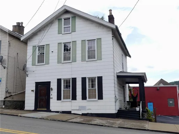 a front view of a house with garage