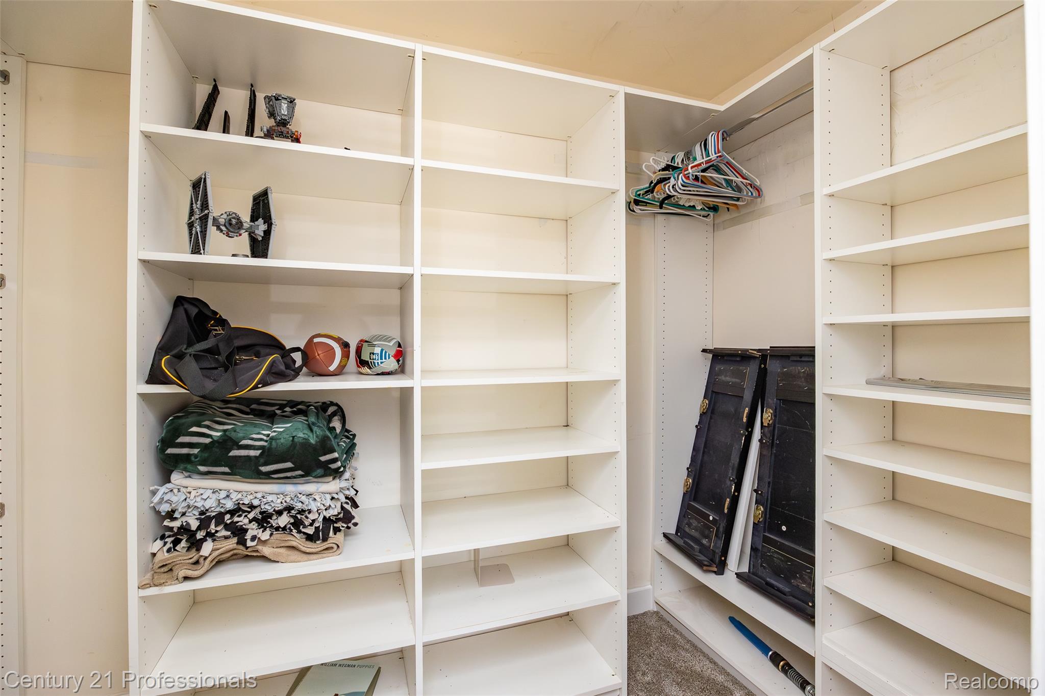 3251 Mann Road Clarkston, MI 48346 - Photo 28 of 40 Custom closet system featuring multiple adjustable shelves and hanging rod storage