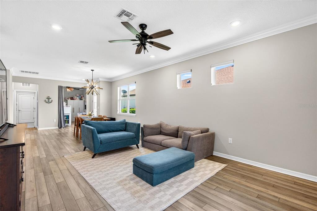 6427 Mooring Line Circle Apollo Beach, FL 33572 - Photo 17 of 34 a living room with furniture and a wooden floor