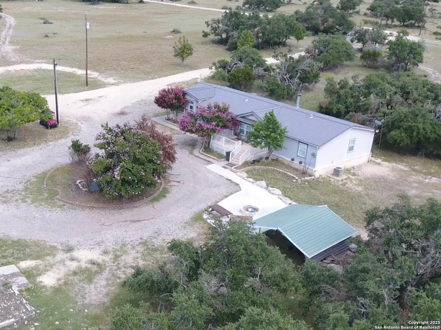 988 Sd 71600 Rocksprings, TX 78880 - Photo 11 of 25 an aerial view of a house with a yard