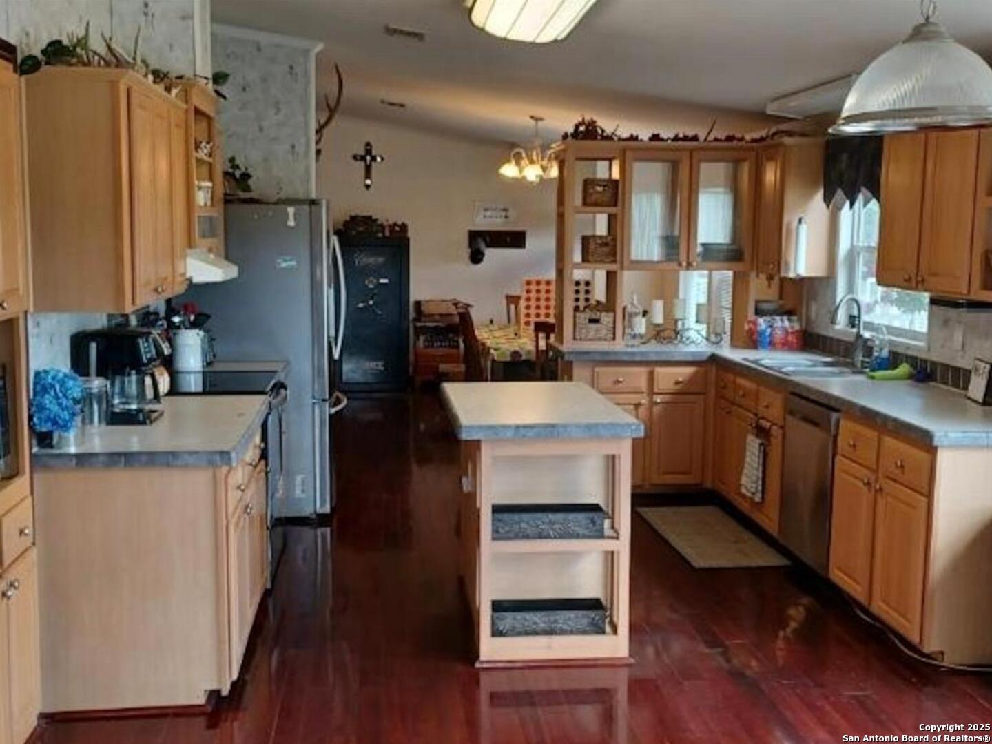 988 Sd 71600 Rocksprings, TX 78880 - Photo 12 of 25 a kitchen with a sink appliances and cabinets