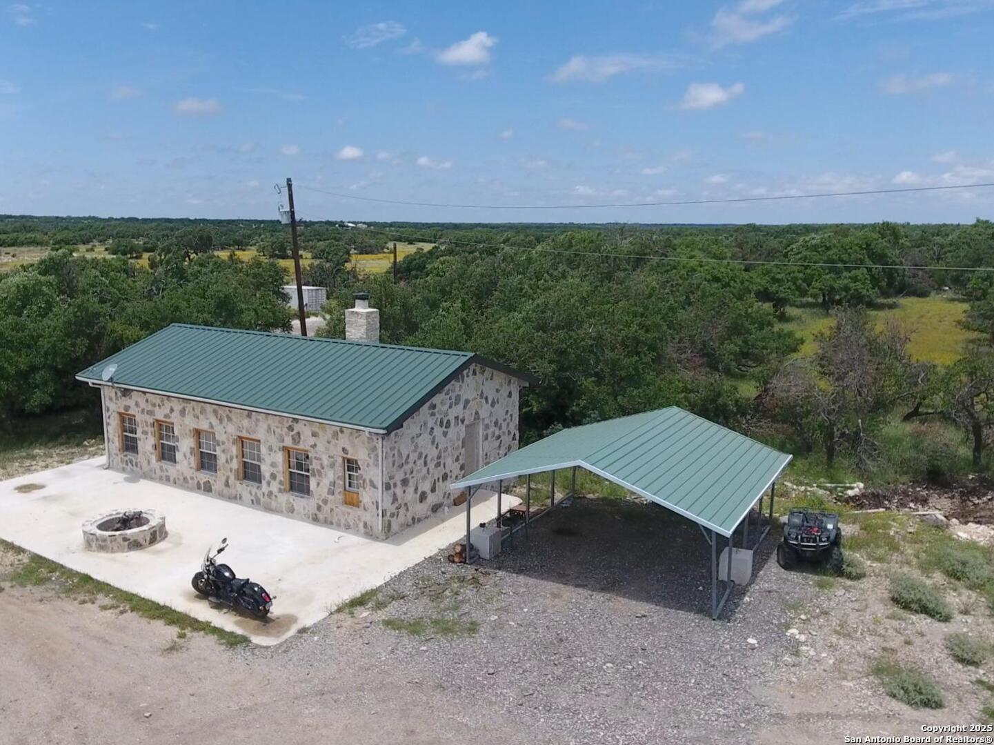 988 Sd 71600 Rocksprings, TX 78880 - Photo 19 of 25 aerial view of a house with a yard and lake view