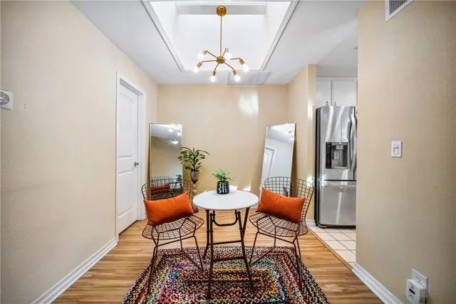 a kitchen with stainless steel appliances a refrigerator stove and microwave