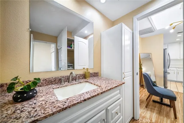 a bathroom with a double vanity sink and a mirror
